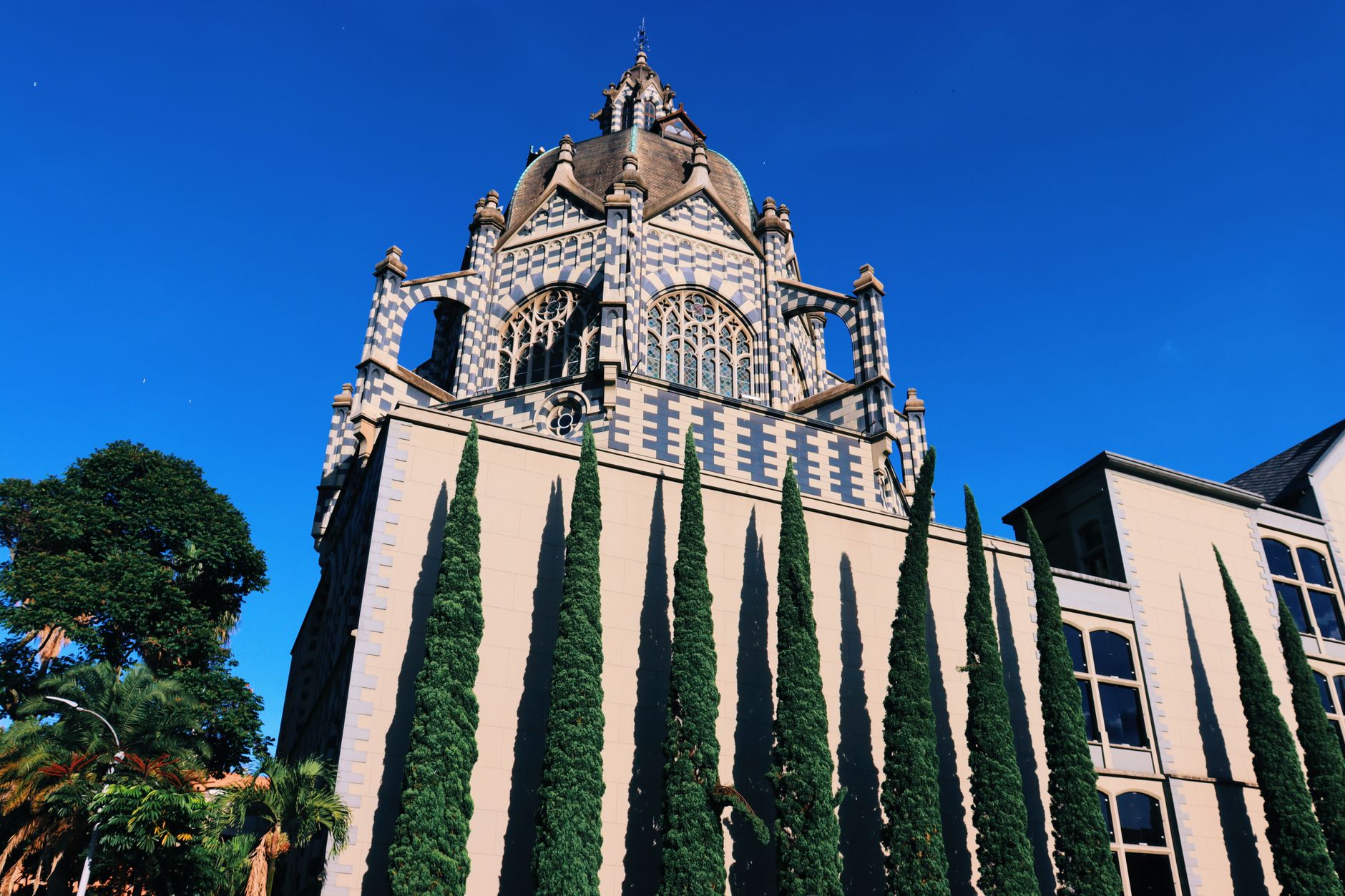 The majestic Palace of Culture in Medellín, Colombia on a sunny day with blue skies.