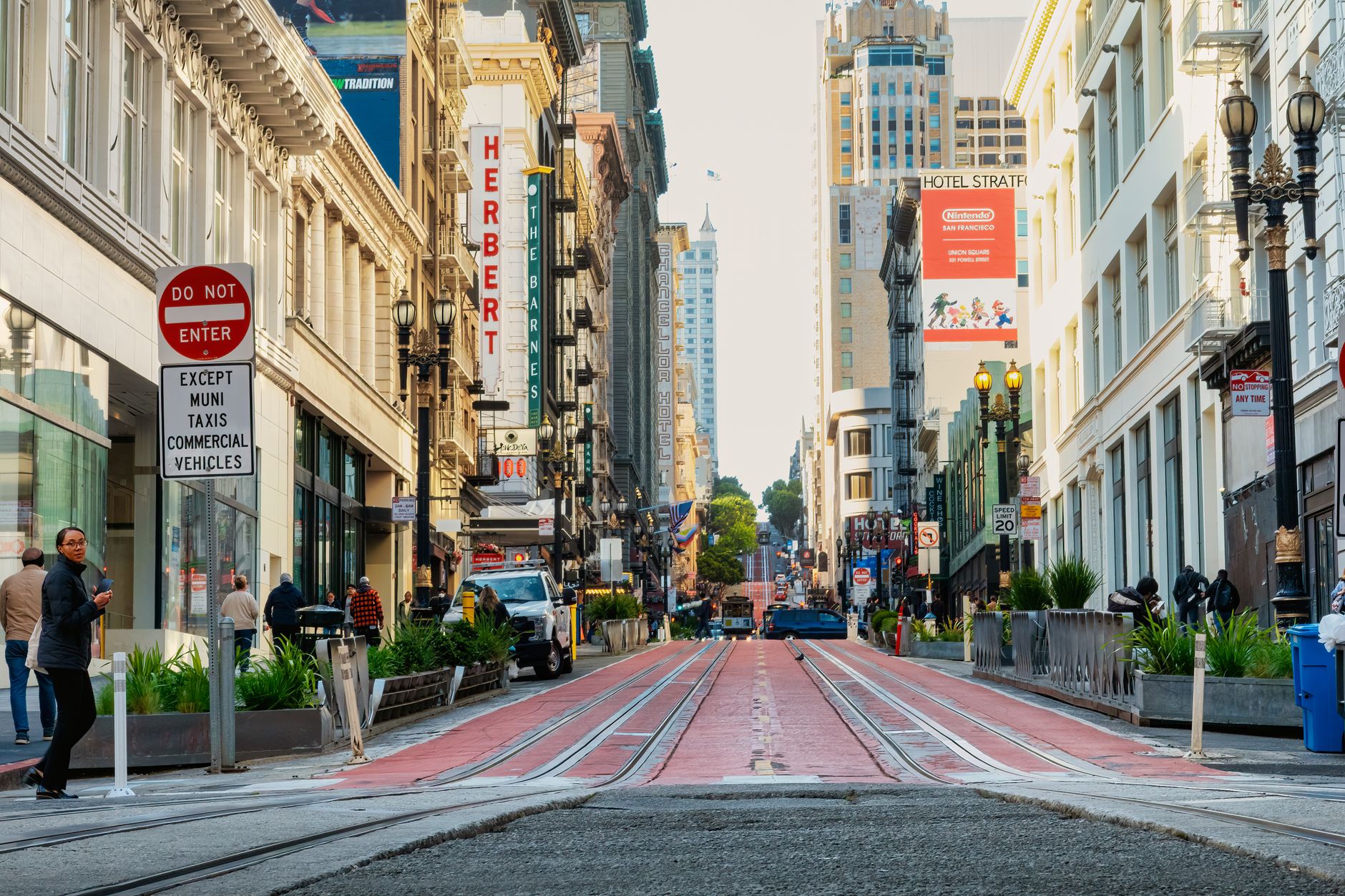 Bustling street view of Union Square, San Francisco with iconic architecture and urban life.